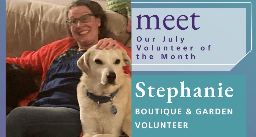 A woman in glasses and a red sweater sits on a couch with a Labrador dog. Text reads: "Meet our July Volunteer of the Month: Stephanie, Boutique & Garden Volunteer.